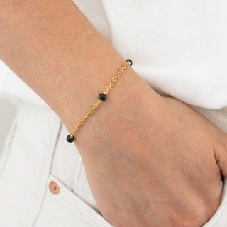 Pulseira ao dourada contas pretas